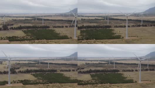 旋转涡轮机的风电场相机向右平移到左多向涡轮机阴天高清在线视频素材下载