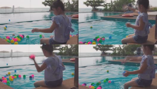亚洲小女孩在游泳池里玩耍高清在线视频素材下载