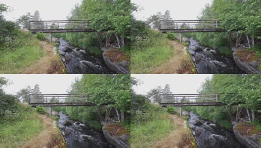 木桥拍摄手持，灰色的天在瑞典的夏天高清在线视频素材下载