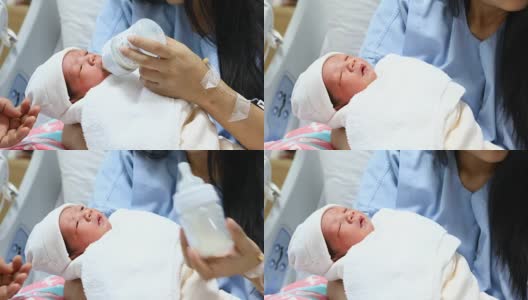 母亲用奶瓶喂养新生儿高清在线视频素材下载