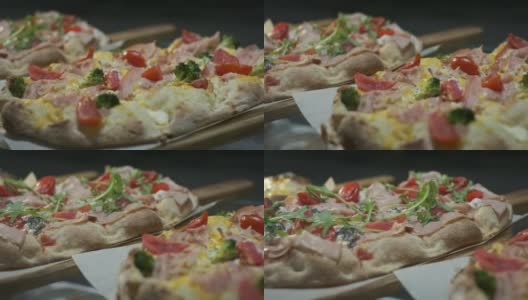 三种开胃披萨。木制托盘上的披萨。高清在线视频素材下载