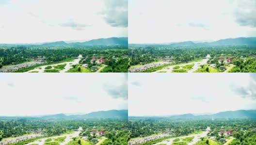 时间流逝拍摄的河流在农村地区与美丽的阳光和山的背景高清在线视频素材下载