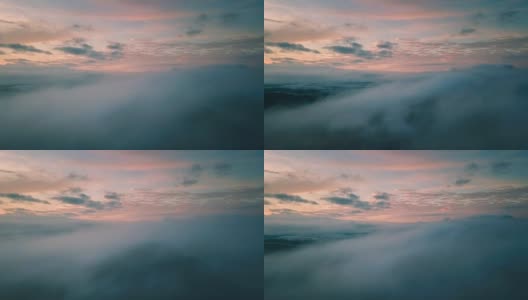在五彩缤纷的日出中，在云层上飞翔。高清在线视频素材下载