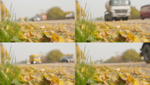 汽车经过黄色的树叶。慢动作高清在线视频素材下载