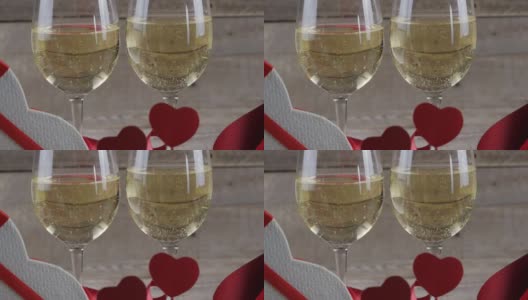 情人节。情人节美酒和玫瑰，心有背景。4 k高清在线视频素材下载