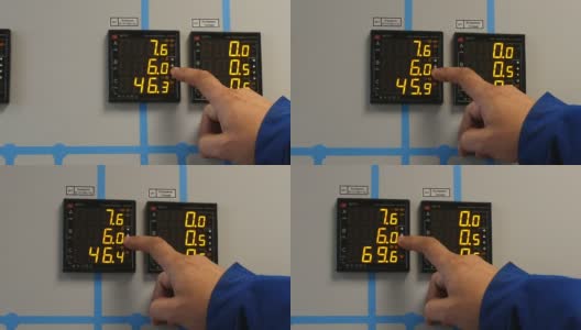 技术员按下带有发光数字的控制面板上的键高清在线视频素材下载
