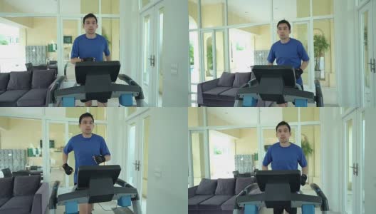 多莉拍摄的男性运动员在跑步机上跑步高清在线视频素材下载