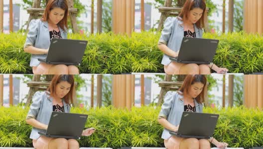 带着笔记本电脑在户外工作的女人高清在线视频素材下载