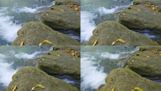 特写瀑布与绿色自然宁静的场景，摄影车拍摄高清在线视频素材下载