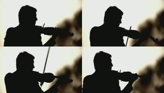 一个小提琴家的剪影高清在线视频素材下载