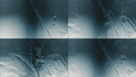 水在玻璃上结冰，形成一种结霜的图案高清在线视频素材下载
