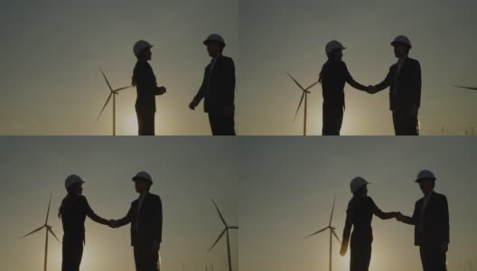 风力发电机握手成功。握手，风力涡轮机，建筑工人，人，自然高清在线视频素材下载