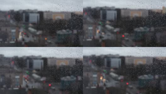 在雨天模糊的城市窗口视图。高清在线视频素材下载