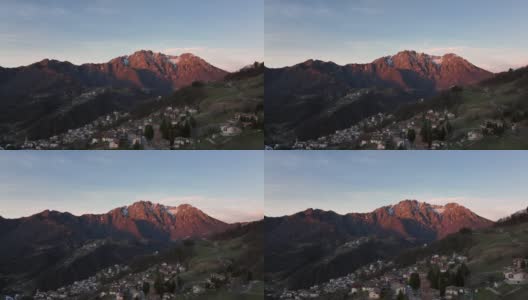 日出时的塞里亚纳山谷及其山脉的鸟瞰图高清在线视频素材下载