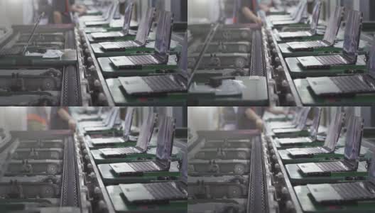 笔记本电脑或笔记本电脑工厂的生产线内景。放大，4K分辨率。高清在线视频素材下载