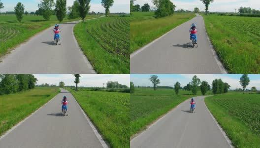 蹒跚学步的孩子正在学习骑他的新自行车高清在线视频素材下载