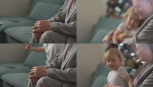 快乐祖母和快乐童年的理念。一个留着短发的时髦白种人女人抱着她的小孙子的肖像高清在线视频素材下载