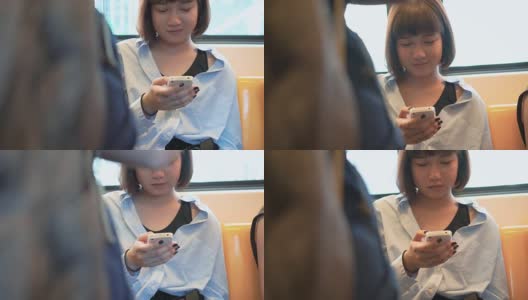 特写女子在火车上使用智能手机高清在线视频素材下载