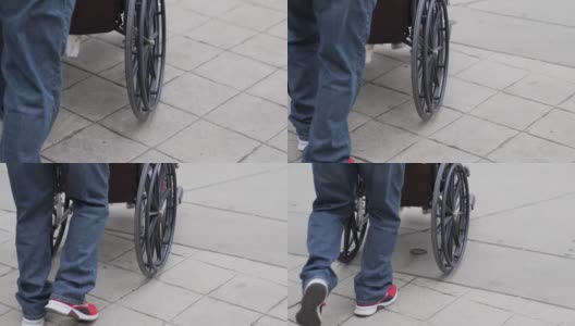 残疾人轮椅乘客被推着高清在线视频素材下载