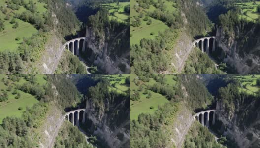 夏季瑞士阿尔卑斯山的兰德瓦瑟高架桥，绿色山谷的鸟瞰图高清在线视频素材下载