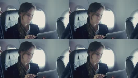 女商人在飞机高清在线视频素材下载
