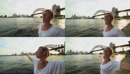 一名年轻女子的肖像在悉尼海港张开双臂高清在线视频素材下载