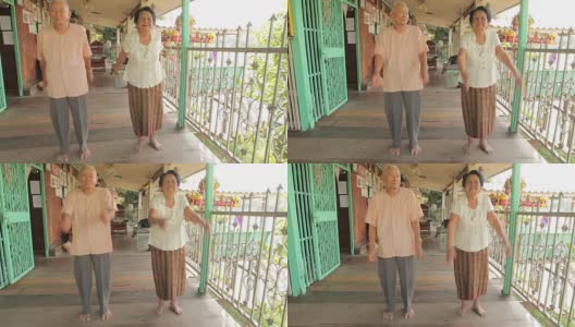 亚洲老年夫妇在家里锻炼手臂高清在线视频素材下载