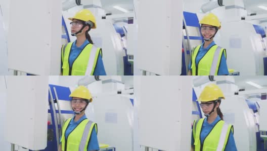 工厂生产线上戴防护安全帽和眼镜的女工。在工业工厂的高科技机器上操作的女孩有自信和微笑的脸。高清在线视频素材下载