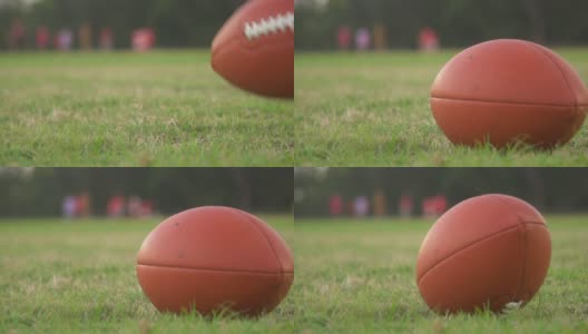 美式足球练习，把球放在前景高清在线视频素材下载