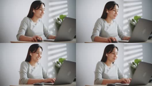 亚洲女性在家里使用笔记本电脑高清在线视频素材下载