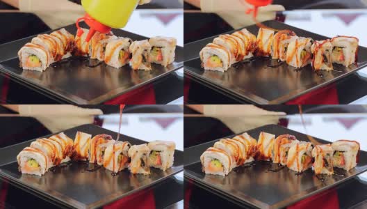 厨师寿司的特写水酱油。餐厅里的寿司高清在线视频素材下载
