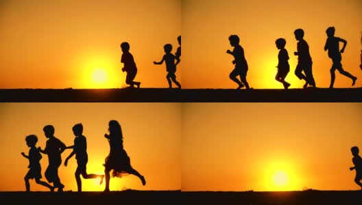 5个孩子一家人在夕阳下奔跑的剪影高清在线视频素材下载