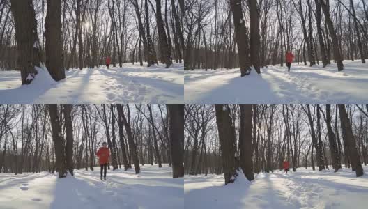 可爱的男孩在冬季公园跑步的慢镜头高清在线视频素材下载