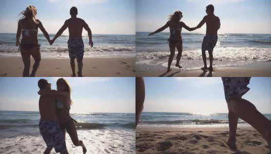 一对热恋中的年轻情侣在海滩上奔跑，男人拥抱他的女人，旋转着身体。女孩跳进男朋友的手里，他在美丽的海边带着她旋转。两人在度假时玩得很开心。慢镜头高清在线视频素材下载