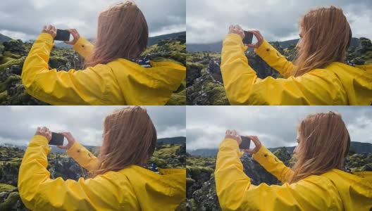 女人欣赏冰岛的岩石和苔藓景观高清在线视频素材下载