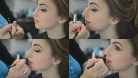 化妆师使模特的嘴唇化妆高清在线视频素材下载
