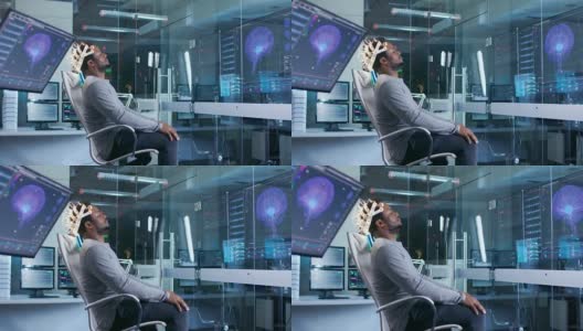 在实验室里，戴着脑电波扫描耳机的人闭着眼睛坐在椅子上。在现代大脑研究/神经研究实验室。监视器显示脑电图阅读和图形大脑模型。高清在线视频素材下载