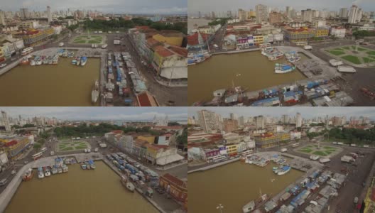 在巴西亚马逊的旧港口城市贝伦杜帕拉(Belem do Para)，航拍盘环绕着码头上的船只和殖民时期的建筑立面高清在线视频素材下载