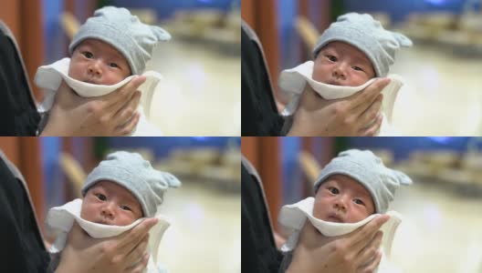 亚洲母亲给新生儿喂奶后打嗝高清在线视频素材下载