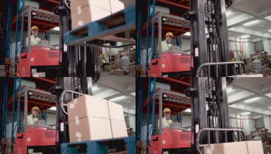 亚洲华人高级工人使用叉车在工业工厂搬运货物高清在线视频素材下载