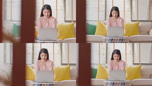 企业家美丽的商业亚洲年轻女性穿粉红色毛衣工作与笔记本电脑在家里。自由职业妇女工作网上销售营销，网上购物在家里。小型企业创业概念高清在线视频素材下载