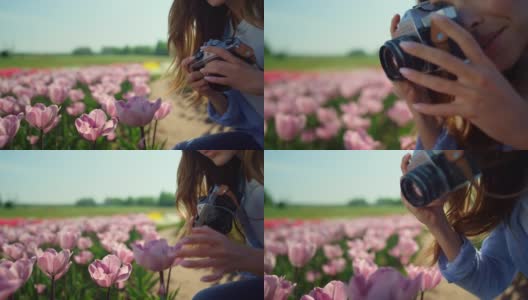 近距离拍摄美丽的女人与专业相机在花的领域。高清在线视频素材下载