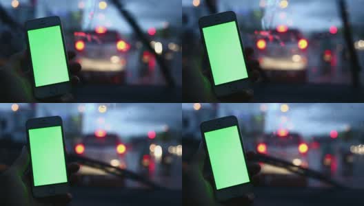 绿色屏幕，在车上用智能手机的人高清在线视频素材下载
