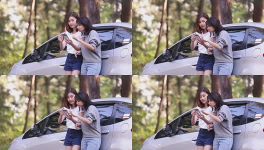 在她的车抛锚后，美丽的女孩在路上聊天并寻求帮助。高清在线视频素材下载