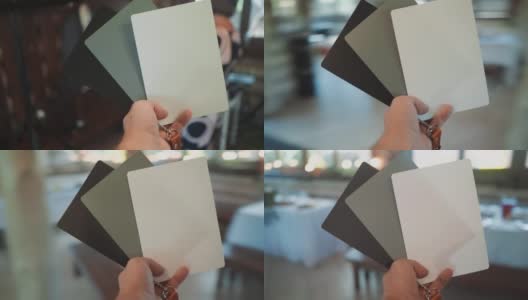 摄影师在餐厅用卡片调整相机高清在线视频素材下载
