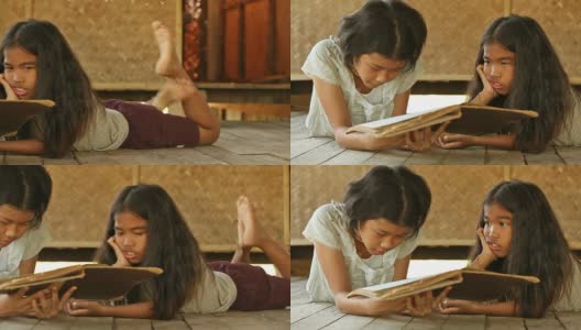 读这本书的亚洲女孩高清在线视频素材下载