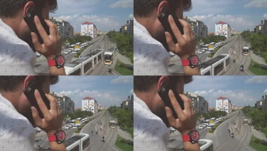 在桥上使用智能手机的男人高清在线视频素材下载