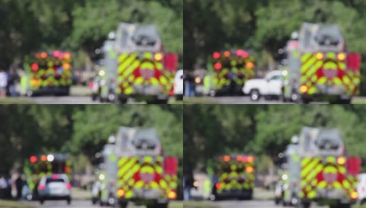 Ems和消防车在事故现场-故意模糊和热变形的道路高清在线视频素材下载