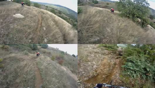 骑车人骑下山的山路-股票视频高清在线视频素材下载