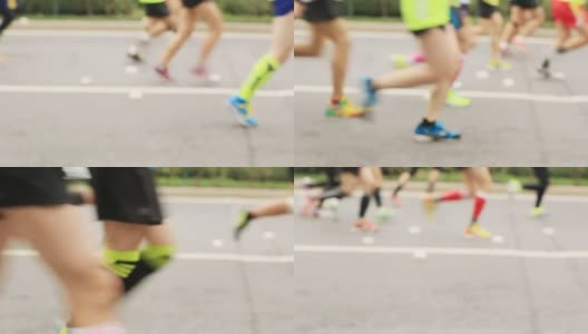 在城市道路上跑的分散的马拉松运动员高清在线视频素材下载